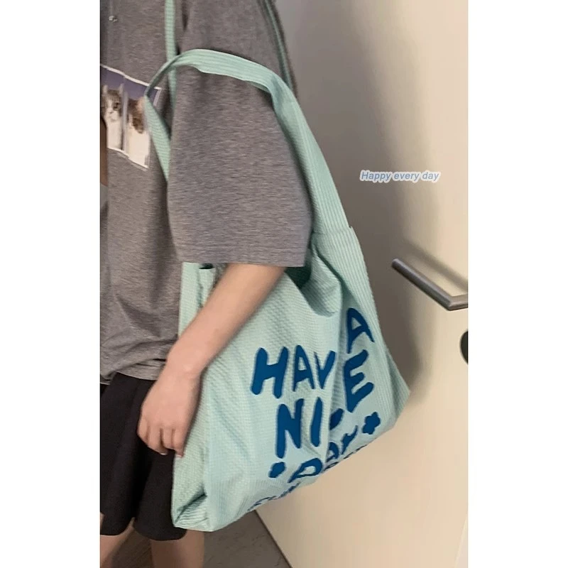 休闲字母帆布包包女2025新款潮时尚学院风托特包韩国单肩腋下包