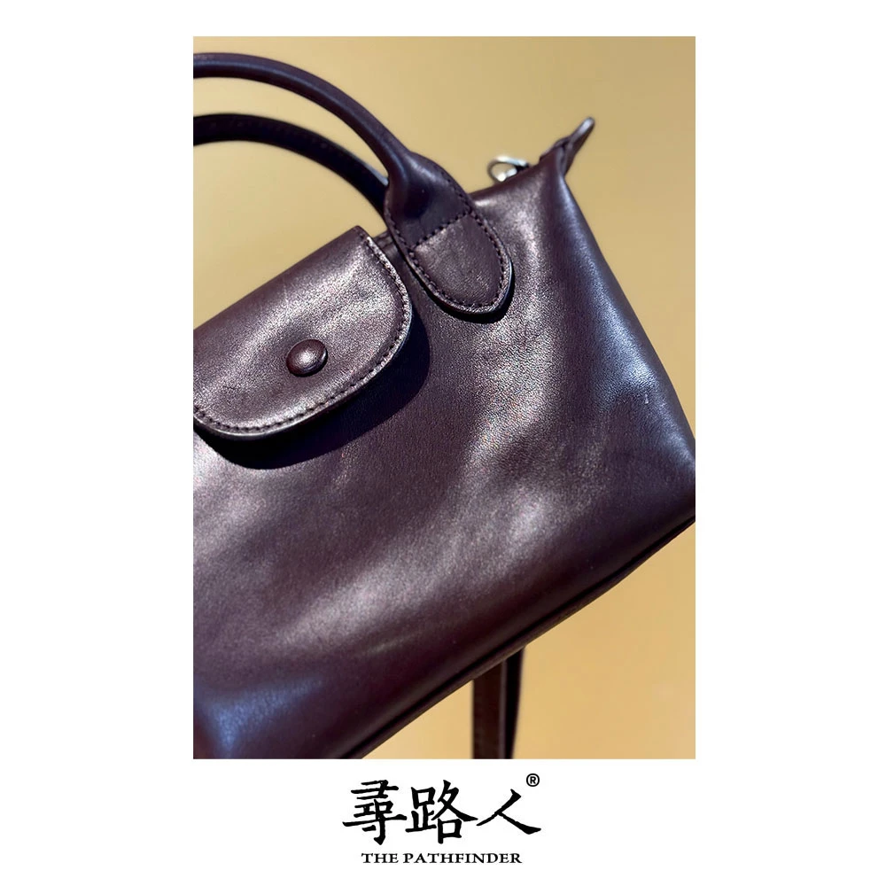 寻路人百搭通勤风女士牛皮手提斜挎包小饺子包