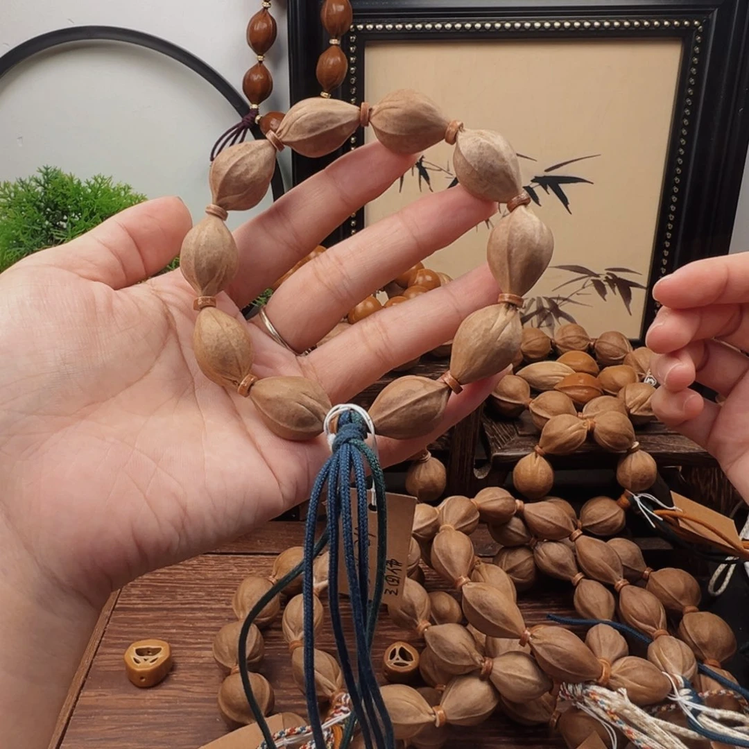 辉***青手串橄榄核15.24梅林铁核三面佛