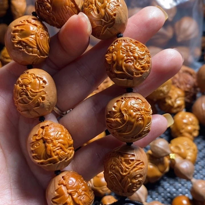 橄榄核吊坠包衣关公