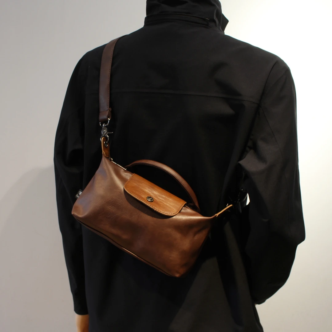 高级感小众包包男女2025新款超火单肩斜挎包复古小手提包饺子包潮