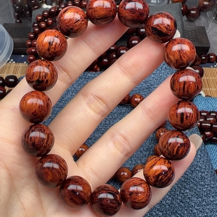 豆***富藤类海南红降芝麻点1.2圆珠（瑕）