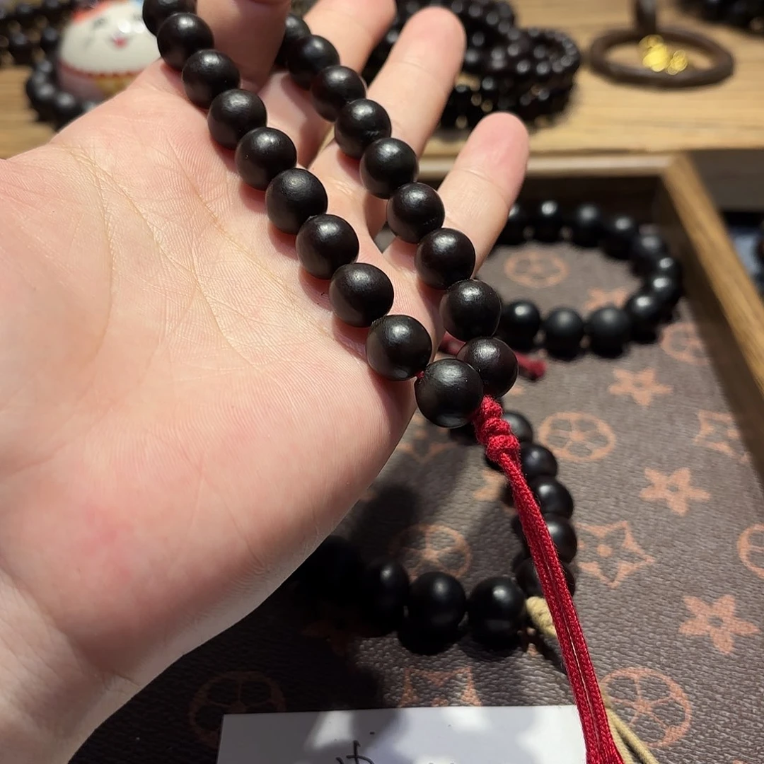 草珠菩提吊坠手持