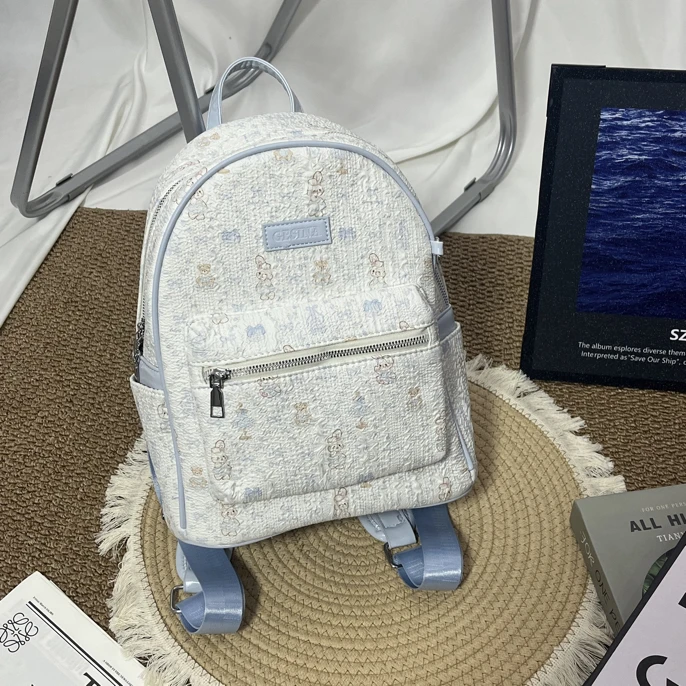 蓝色泡泡纱兔子小熊满印可爱风布面大容量学生通勤休闲双肩包