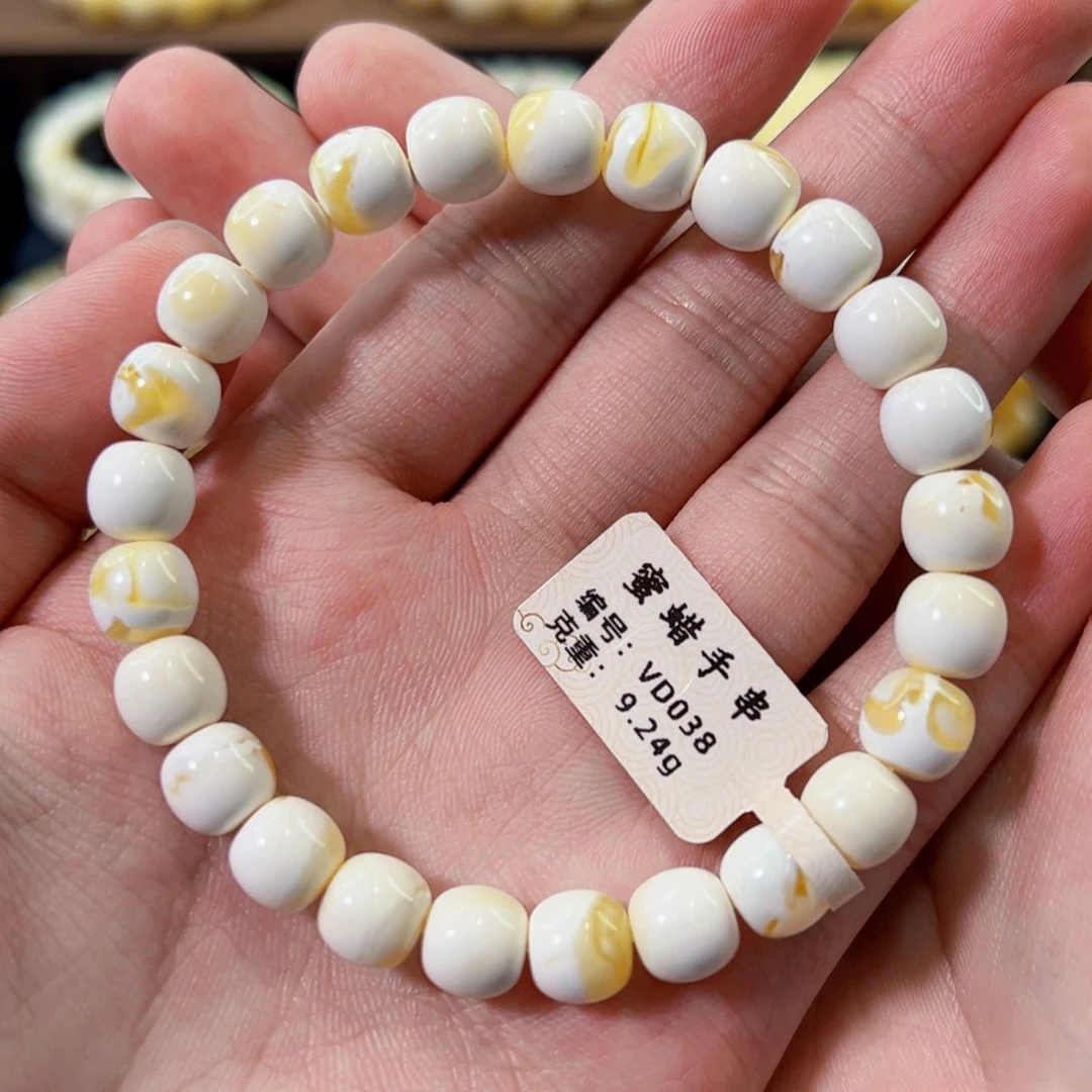 未镶嵌琥珀裸石8.5mm金漆白溶洞老型手串