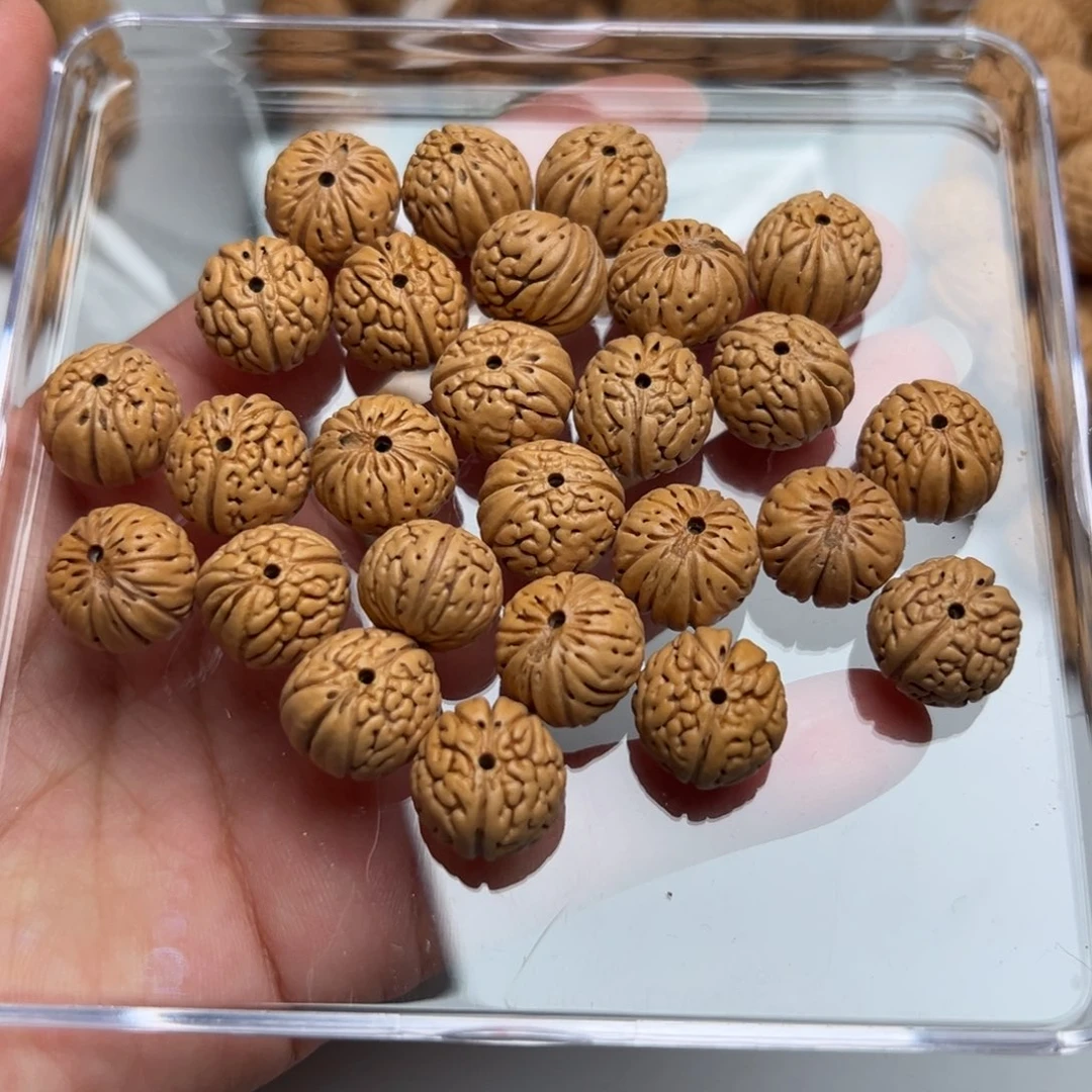 哎***呵14尺寸树王纽扣桃核手串