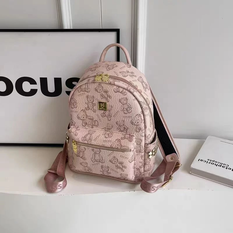 双肩包女款爆款2025新款可爱小熊双肩背旅游学生大容量皮革通勤包