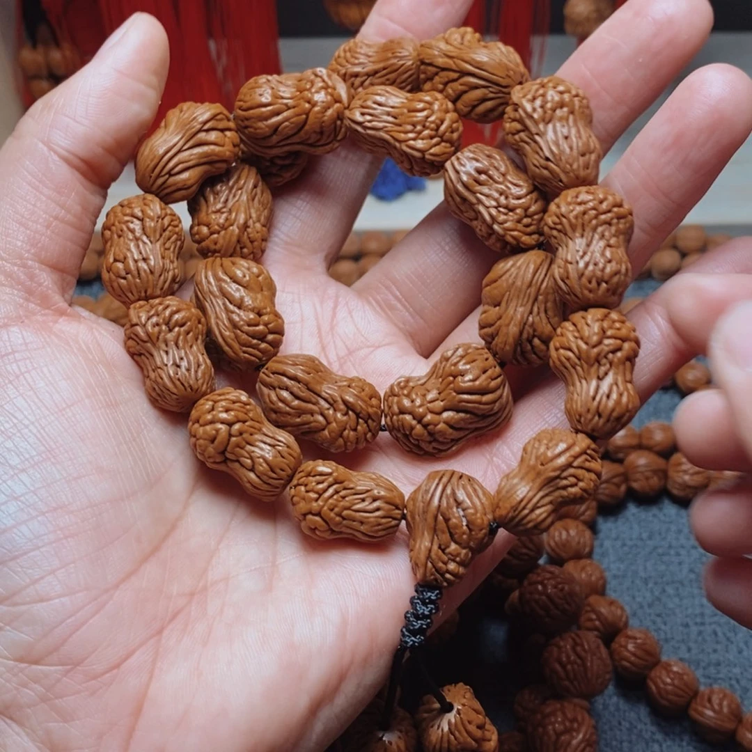 桃核吊坠桃枭手持1