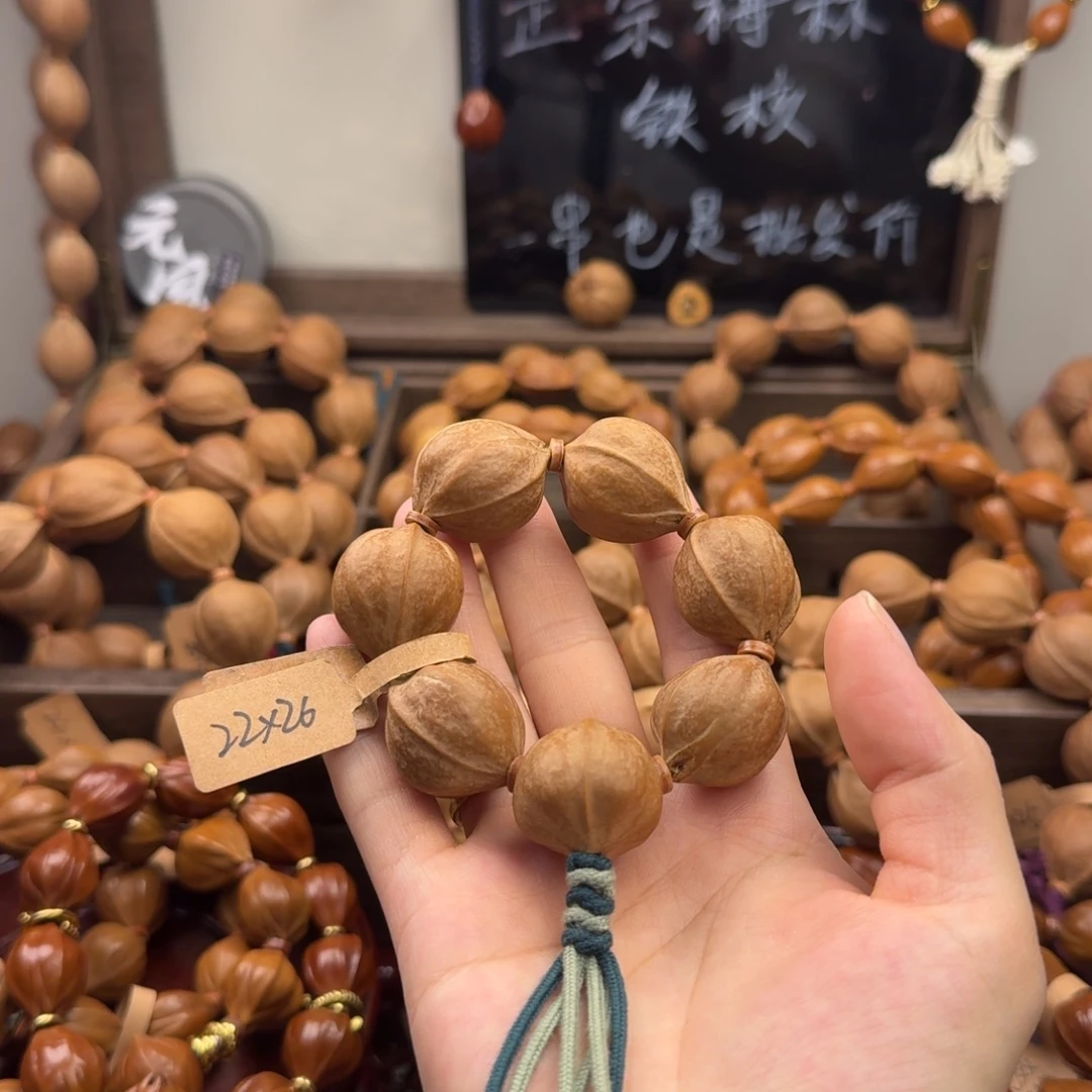 龙***龙橄榄核吊坠22.26手捻