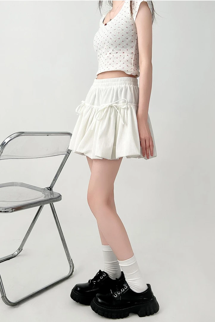 白色半身裙女夏季2025新款高腰a字短裙蝴蝶结设计感蓬蓬裙花苞裙