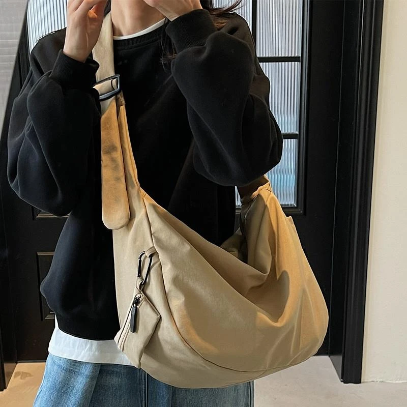 德国ins风休闲百搭韩版帆布包斜挎包女学生党上课通勤大容量饺子