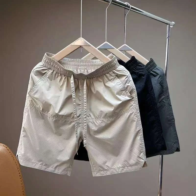男士夏季新款速干宽松潮流薄款打孔简约运动时尚透气外穿男士短裤