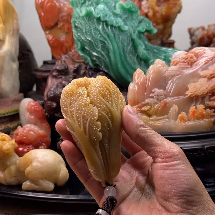 田黄石百财手把件