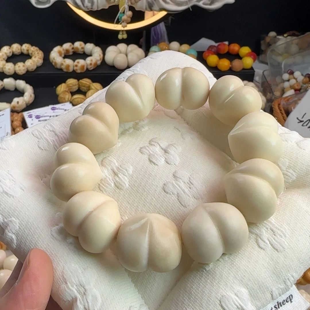 吊坠菩提根/象牙果微瑕光面屁桃手串一条