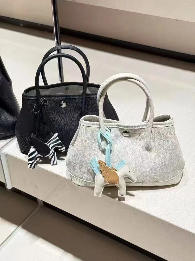 斜挎包耐磨水桶包托特包斜跨包轻奢蓝色纯色女士单根