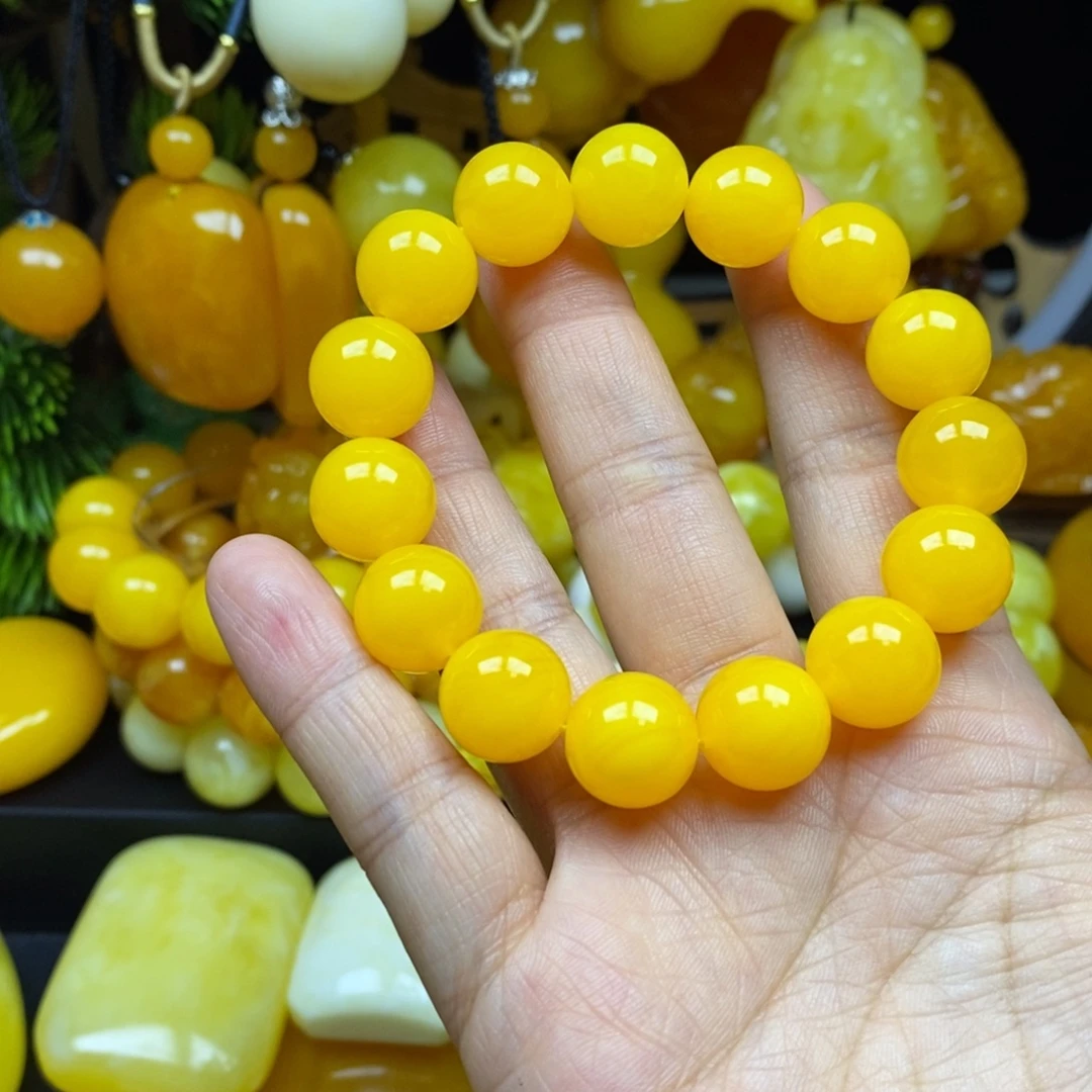 旺****无非金属鸡油黄14手串