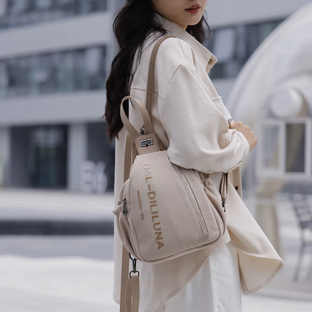 迪莉露娜品牌D&L时尚双肩胸包可双背斜跨手提包包多功能-A97354