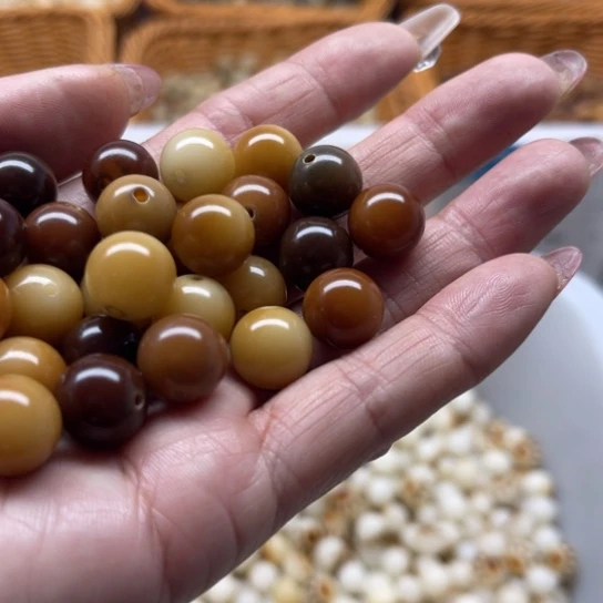 琉***锦白玉菩提吊坠精品12焦糖圆珠50