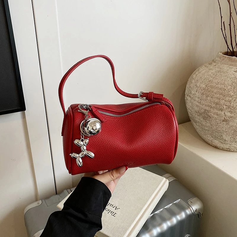 韩国小众红色手提包包女2025新款荔枝纹软皮圆筒包超火单肩斜挎包