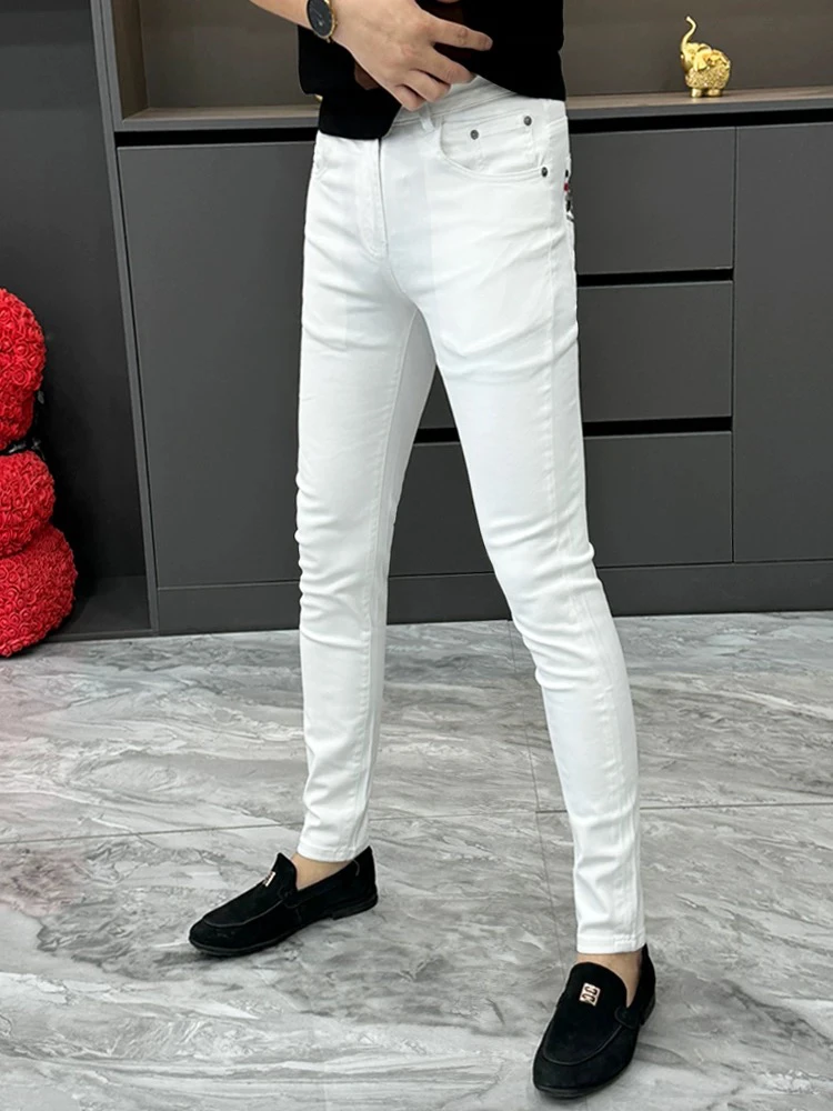 男士百搭白色夏季薄款潮流时尚修身小脚韩版弹力牛仔裤