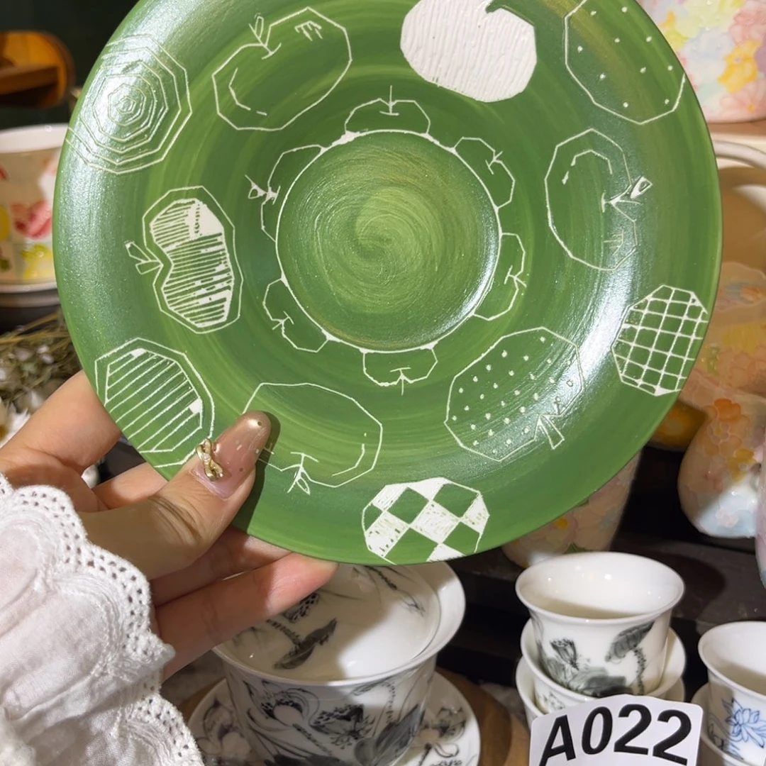 手柄款陶瓷苹果盘
