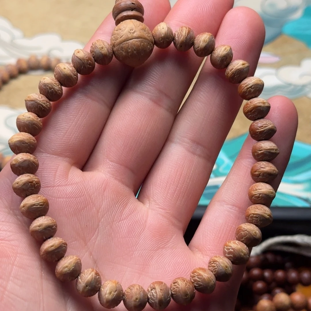 尘****凤眼菩提吊坠酸枣核凤眼菩提