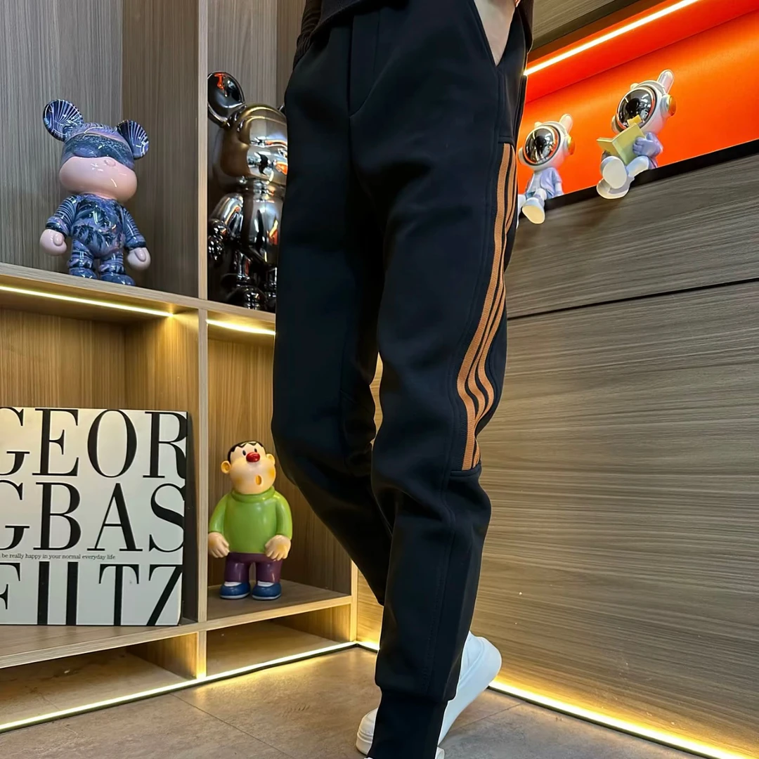 708春季新款时尚百搭刺绣织带休闲裤