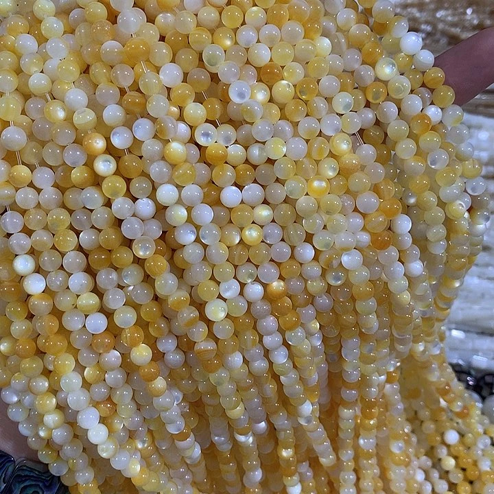 5.5mm天然黄金贝圆珠一条