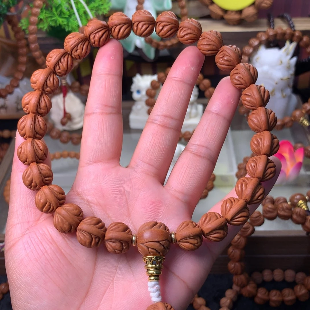 火***星桃核吊坠双脊龙手持14