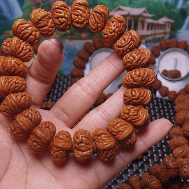 佛***心文玩核桃吊坠龙纹桃核手串