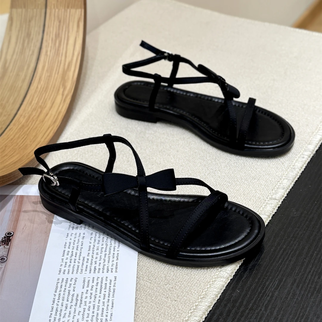 韩版气质蝴蝶结甜美凉鞋女2025新款夏平底洋气镂空爆款沙滩罗马鞋
