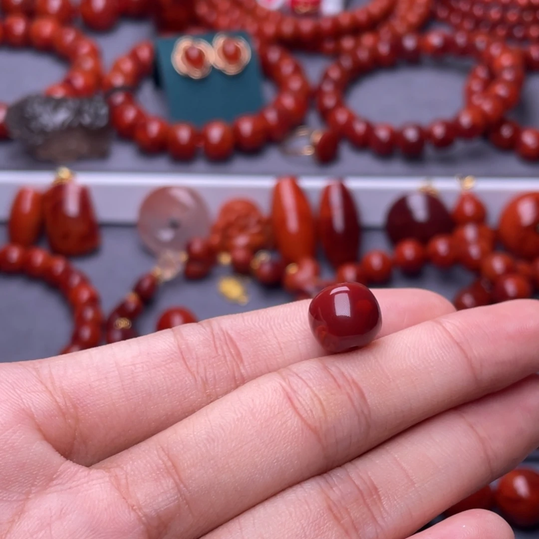 圣***李南红玛瑙其他未镶嵌原矿11mm瓦西牛血双色老型单珠
