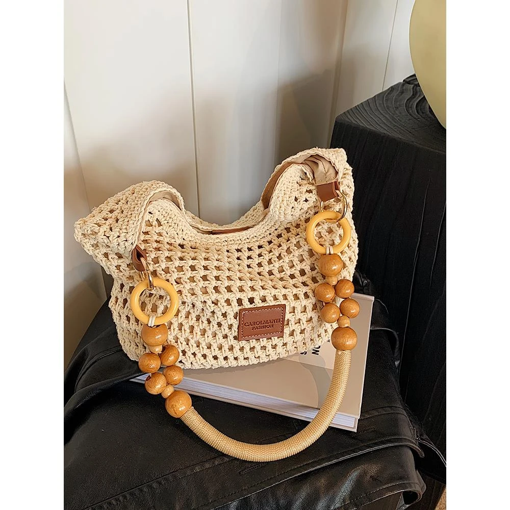 夏天海边沙滩包包女2025新款大容量镂空编织单肩包手提托特水桶包