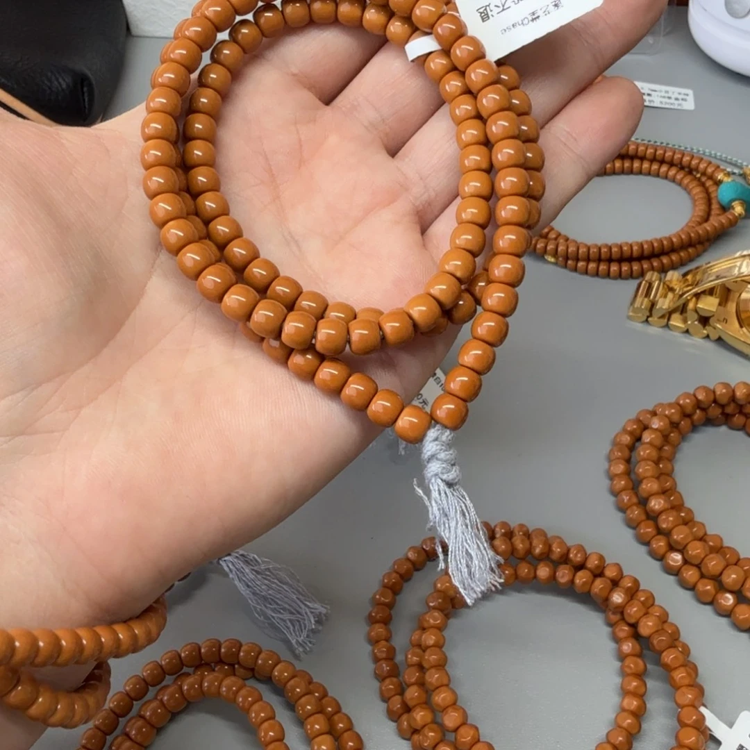 皓***程手串橄榄核小微白62尺108老挝红核核尖