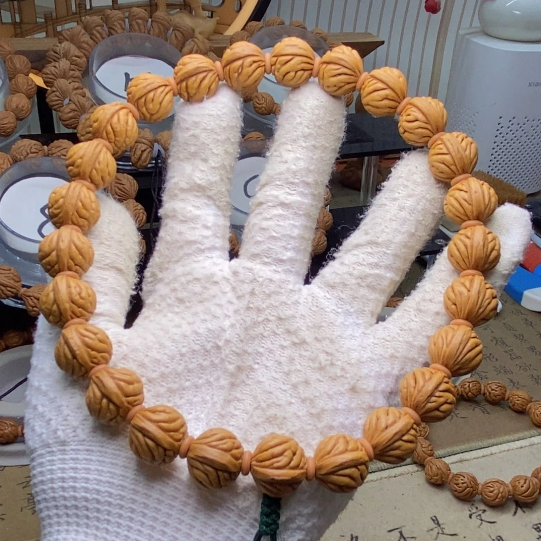 桃核把件小凤羽手持