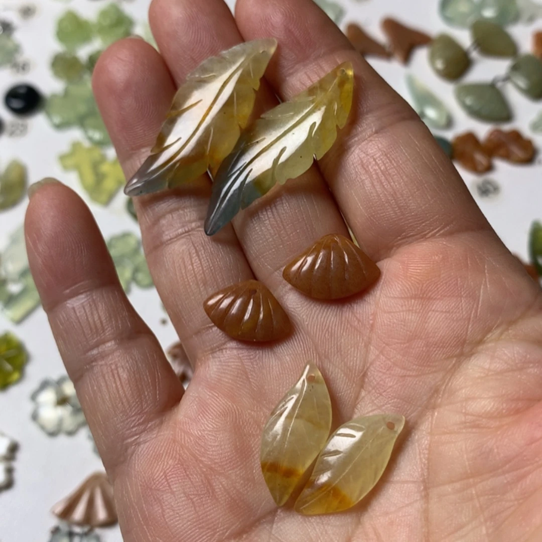 幸***雯蛇纹石玉未镶嵌耳坠
