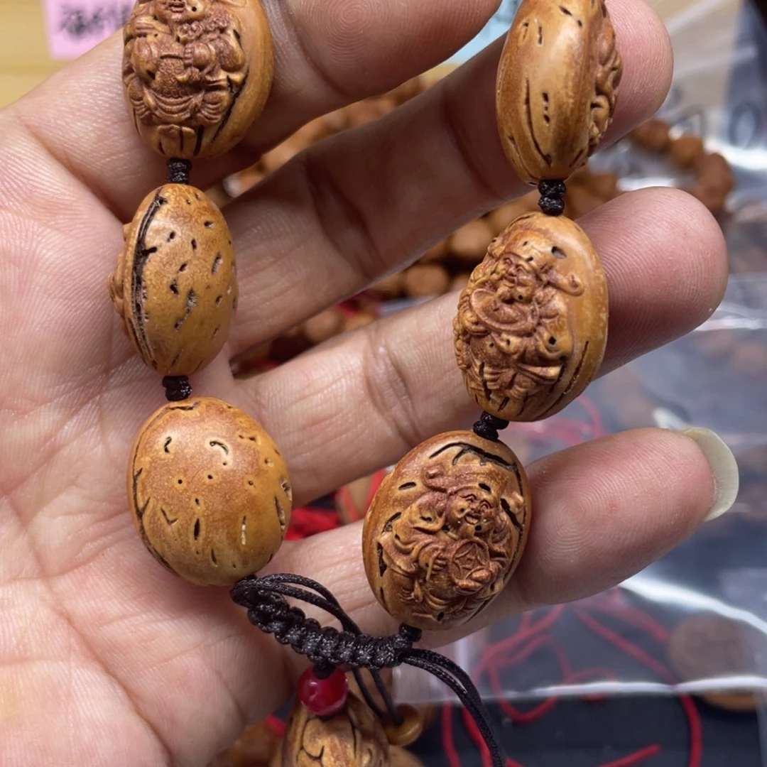 桃核雕刻财神手串