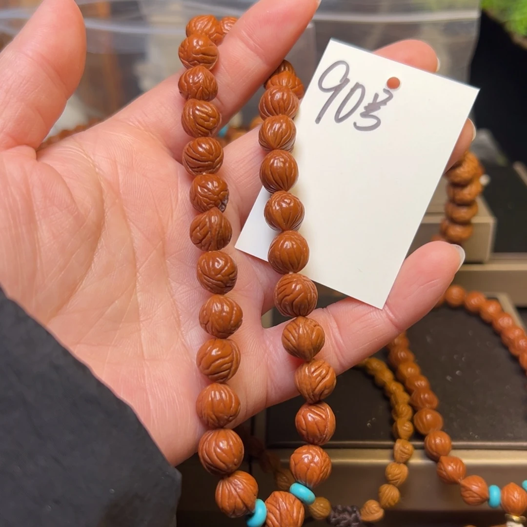 桃核吊坠秦岭龙纹桃核10小奶豆手持