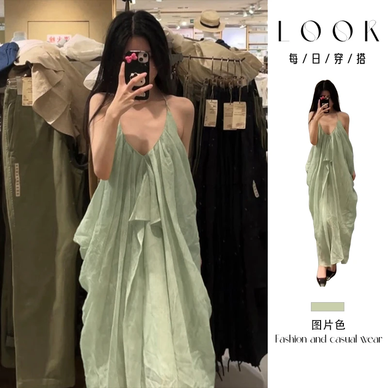 法式气质绿色挂脖吊带连衣裙子女夏2025新款海边度假露背沙滩长裙