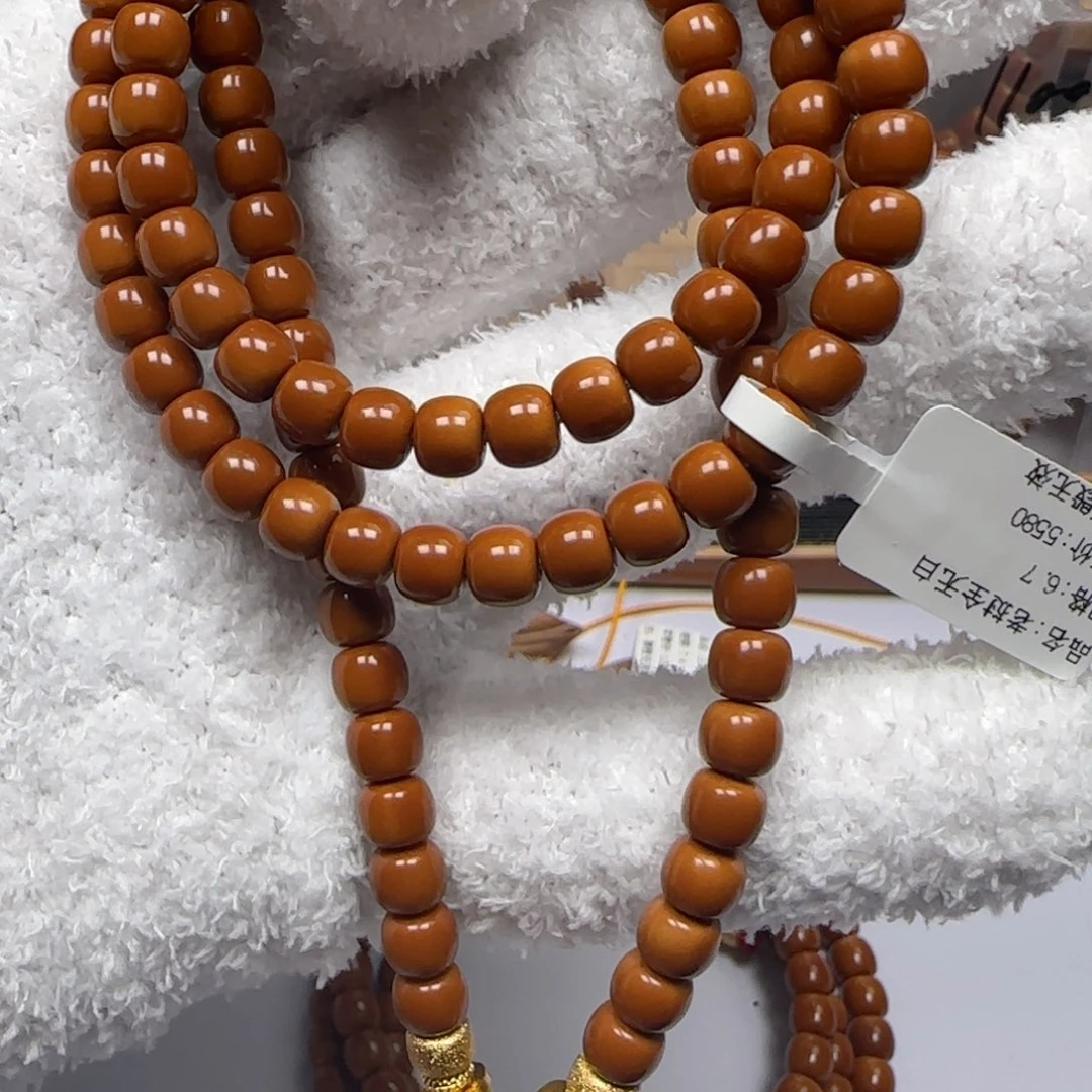 橄榄核吊坠老挝6.7mm全无白长串微微白