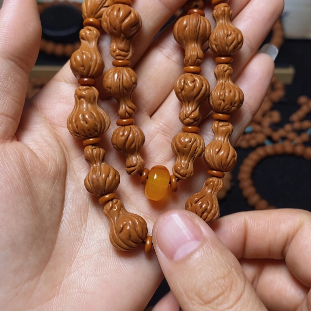 归***启手串桃核秦岭文玩桃核手持