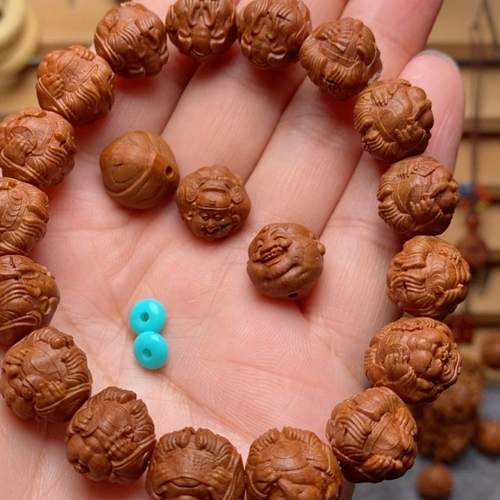 想**啥桃核雕刻横财神手串