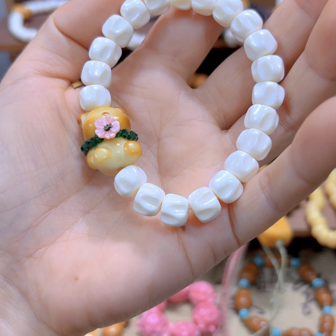 星月菩提手串驼骨百香籽象牙果小熊