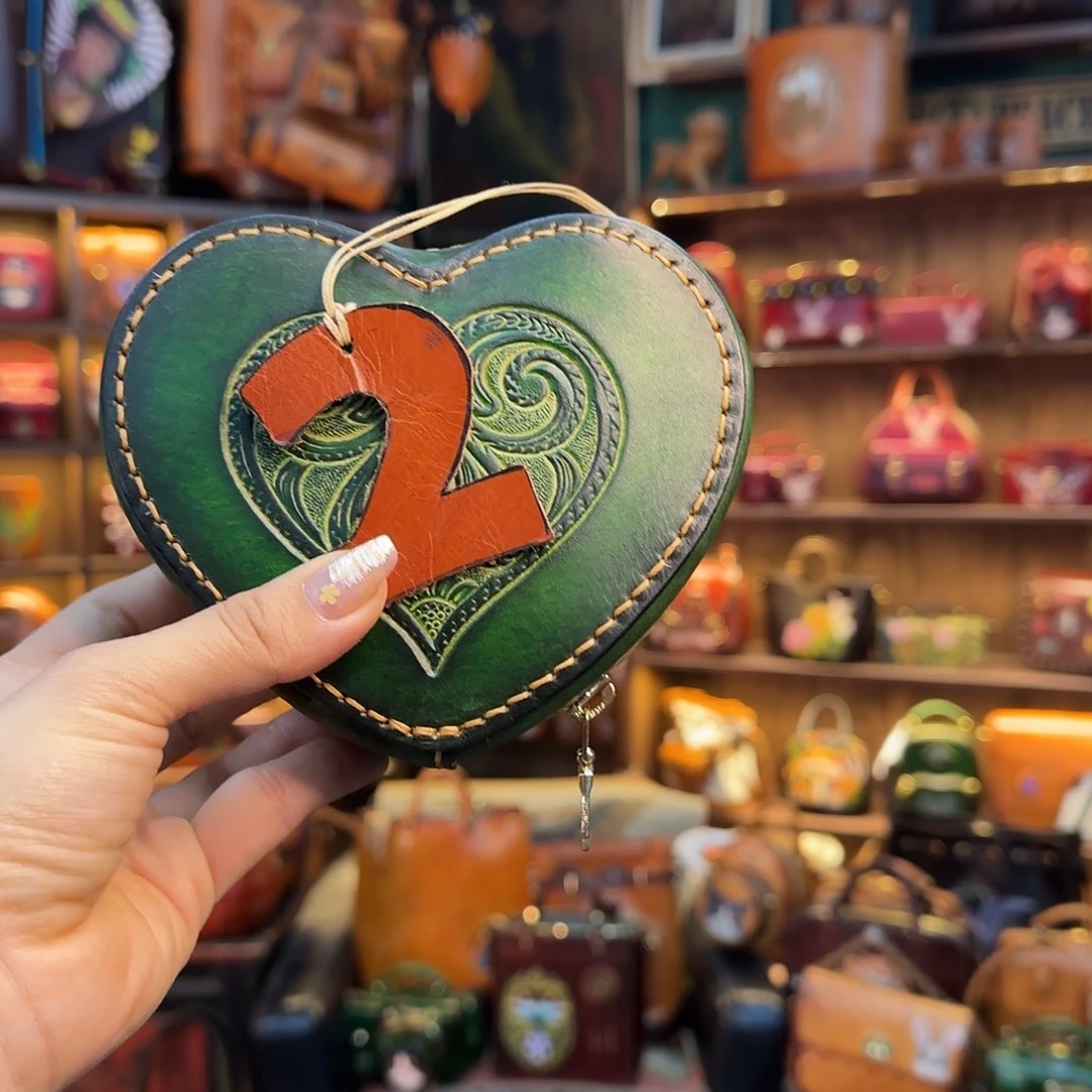 拾***光牦牛剖层皮革2号绿色爱心发财包