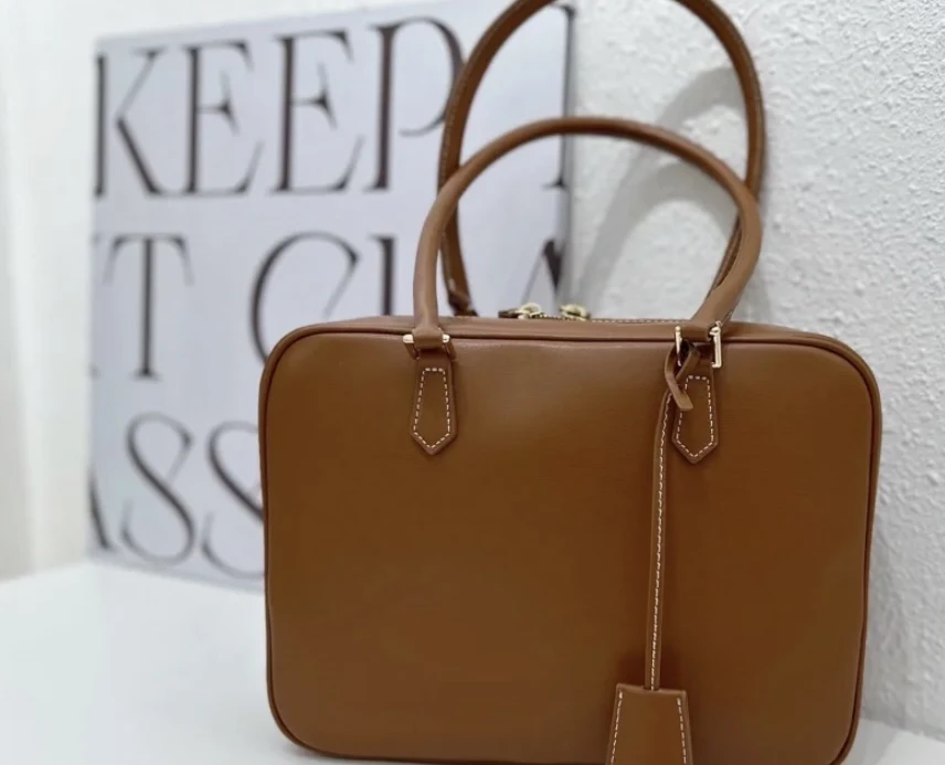 复古羽毛手提包烙哥 MEEGHERBE百搭小方包男女通勤款