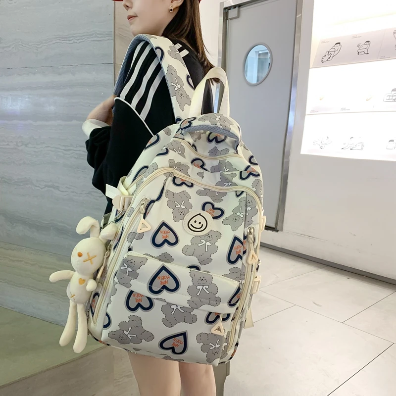 高颜值书包女大学生爱心小众设计简约韩版百搭双肩包女初中高中生