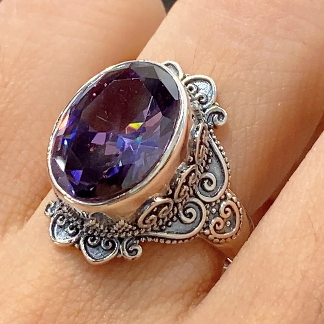 925银合成锆石戒指 民族风精美花边切棱紫色椭圆锆石戒指