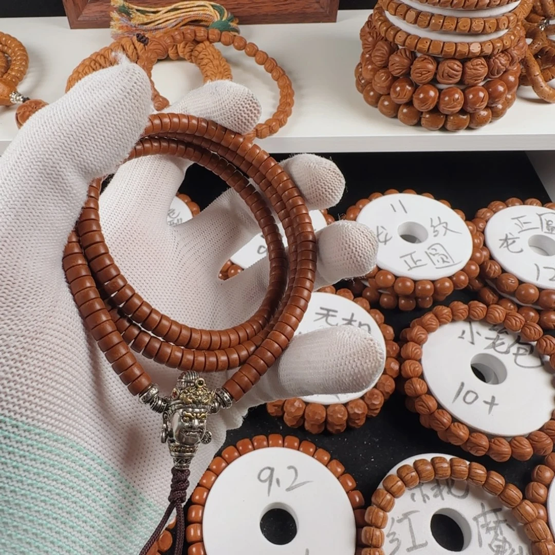 圆***圆桃核手串6.1*3.3无纹药片204片