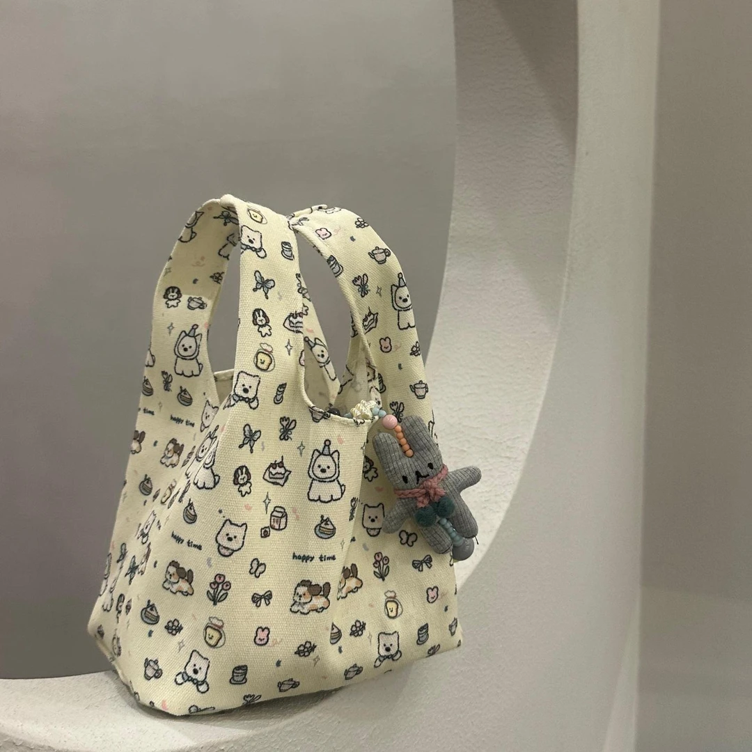 2025新款卡通小狗印花手提包环保帆布便当包大容量通勤便携手腕包