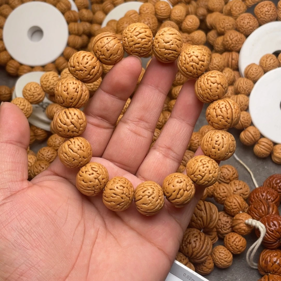 铭***。桃核手串肉纹元宝闪32